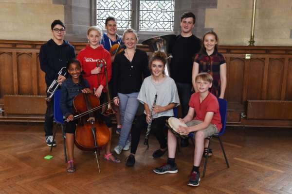 Conductor Holly Mathieson with musicians from NYOS Junior Orchestra