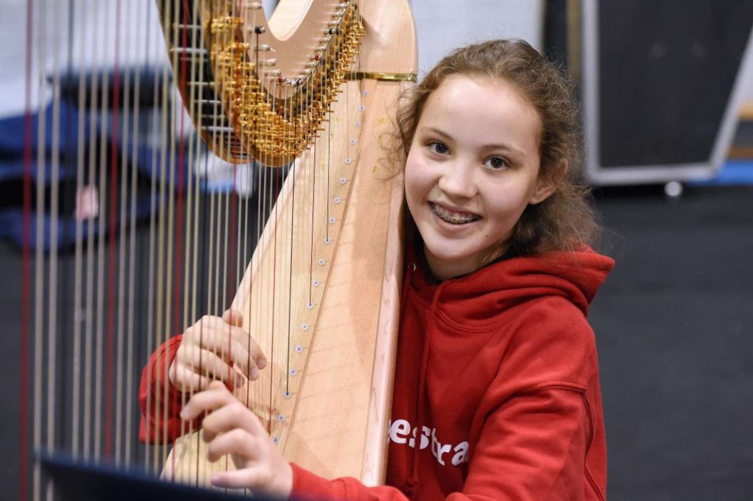 A very happy harpist rehearsing with NYOS Junior Orchestra in July 2015