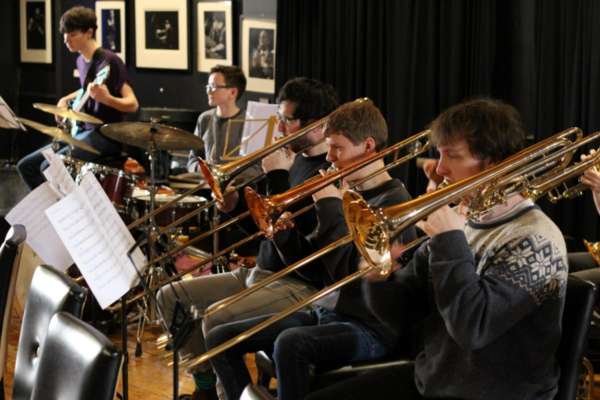 NYOS Jazz Orchestra trombones rehearsing ahead of its Double Big Band performance at HallÃ© St Peter\'s, Manchester
