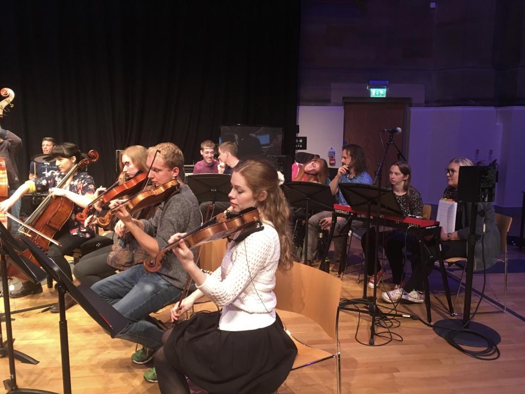 NYOS Futures strings section being put through their paces during rehearsals of Microscopic Dances at the Tom Fleming Centre, Stewart’s Melville College, Edinburgh