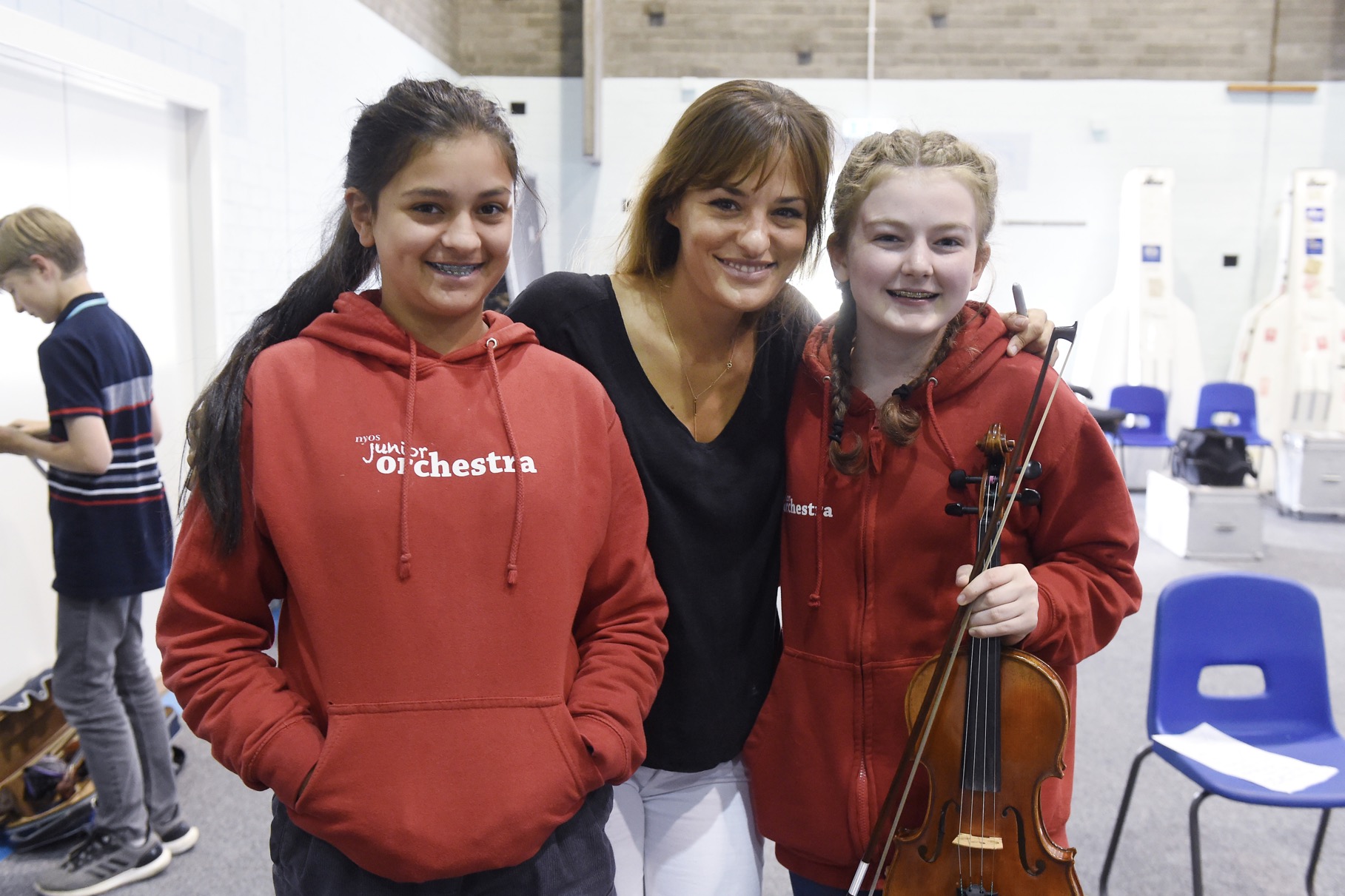 Junior Orchestra members love the experience and clamour for photos with one of their idols.