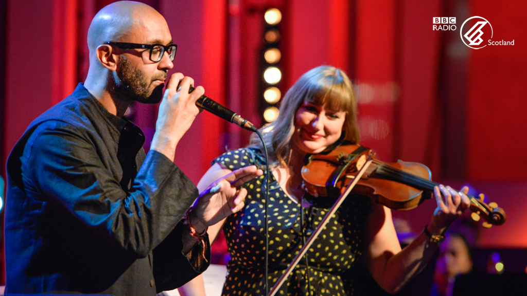 Jason Singh jamming with presenter Seonaid Aitken at BBC Radio Scotland\'s Jazz Nights at the Quay, October 2018. Photograph by Karen Miller, courtesy of BBC Scotland